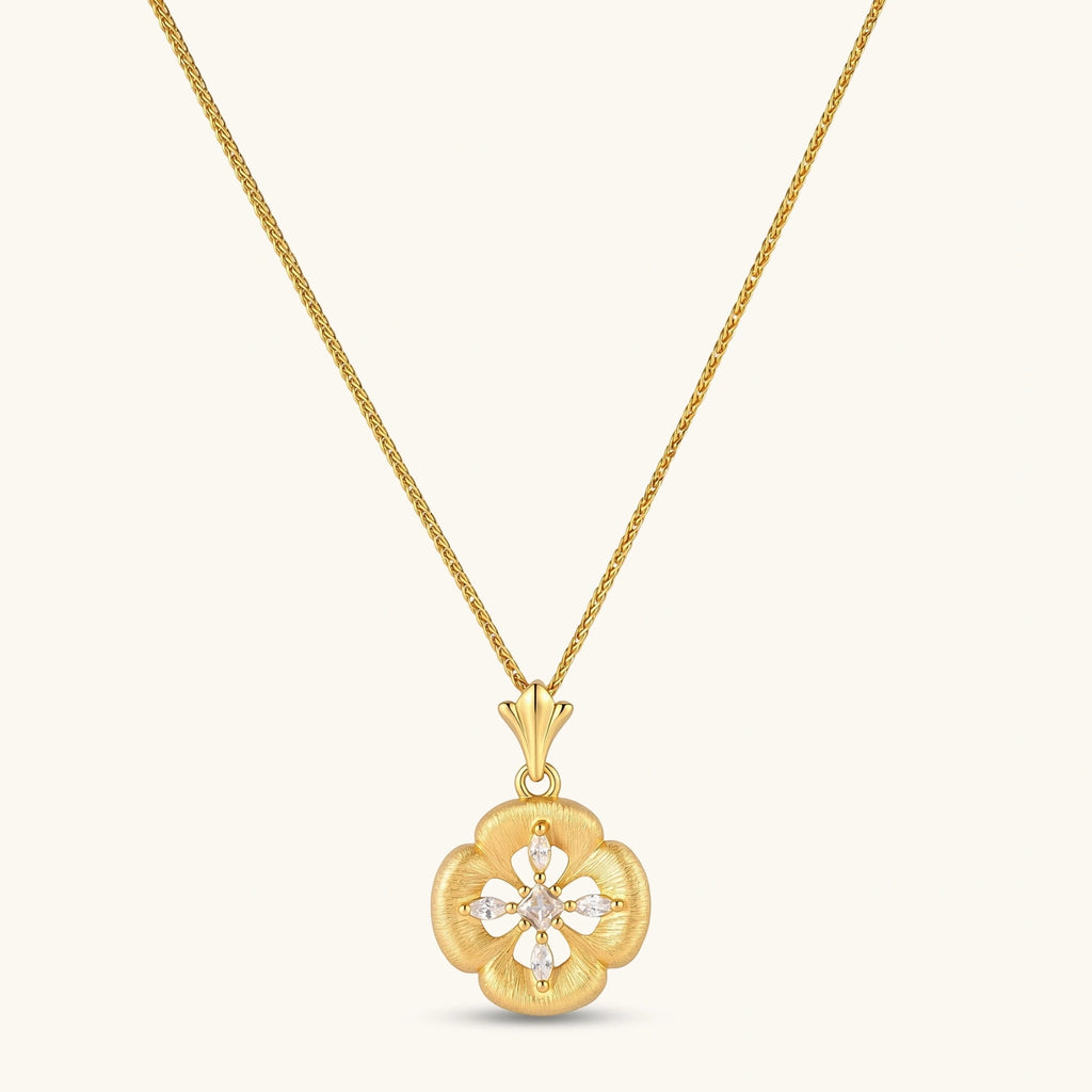 Gold-plated flower pendant necklace with brushed finish, open-work center, marquise CZ stones on wheat chain, S925 stamp.