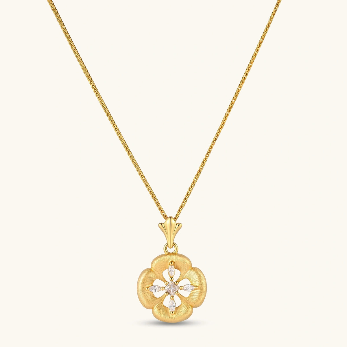 Gold-plated flower pendant necklace with brushed finish, open-work center, marquise CZ stones on wheat chain, S925 stamp.