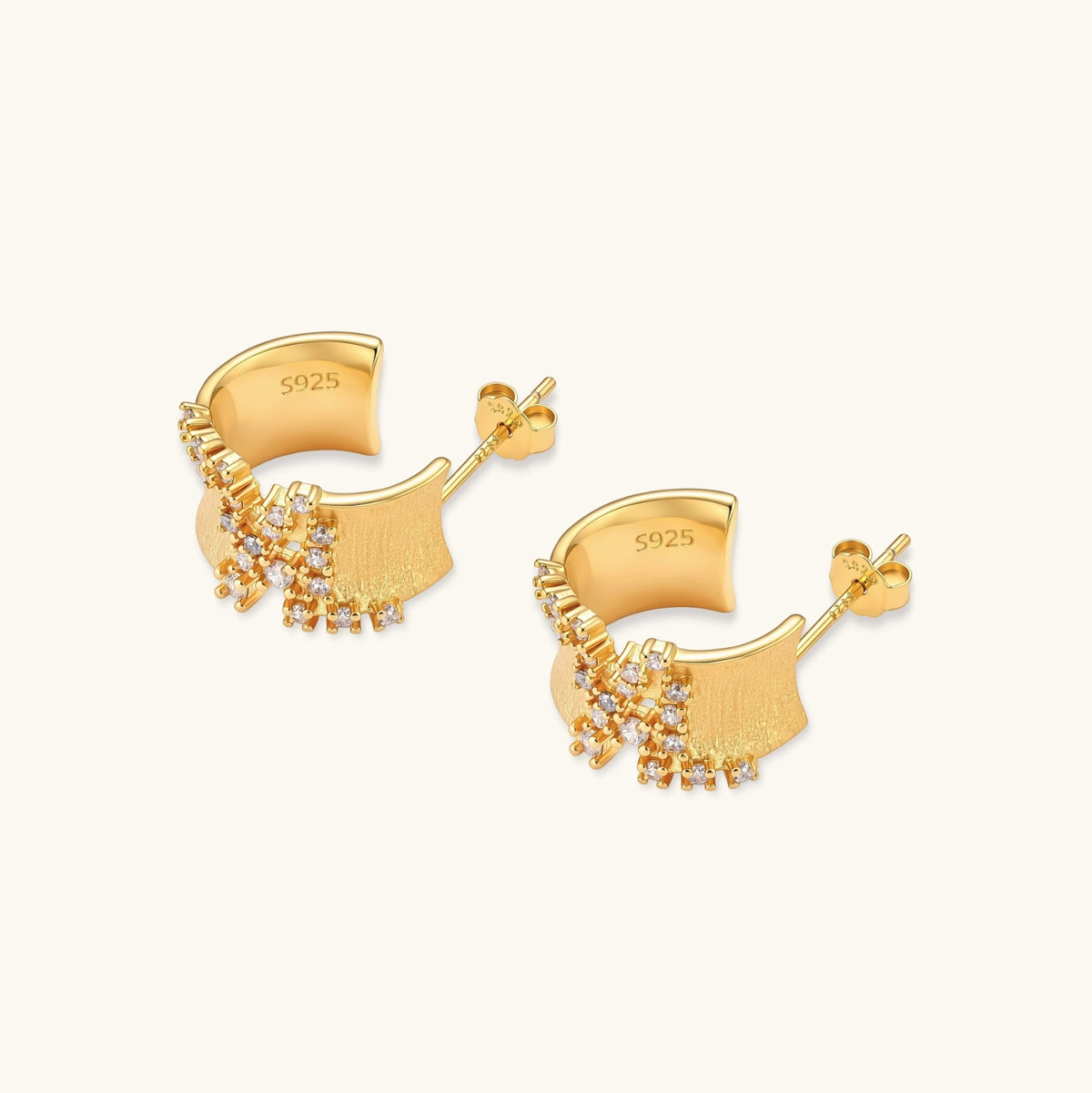 Pair of 18K gold-plated 925 sterling silver C-hoop earrings with brushed finish and scattered cubic zirconia clusters.