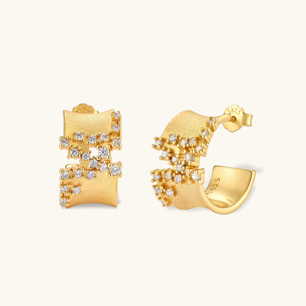 Pair of 18K gold-plated 925 sterling silver C-hoop earrings with brushed finish and scattered cubic zirconia clusters.